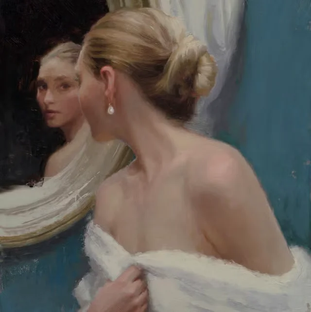 Woman looking herself in the mirror